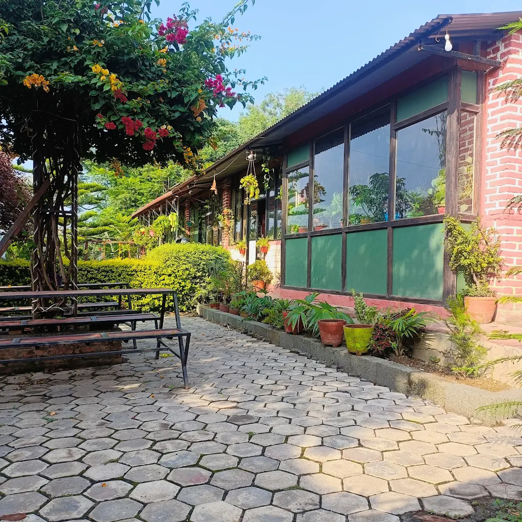 Garden scenery at Peace Garden Restaurant Thecho with walking path